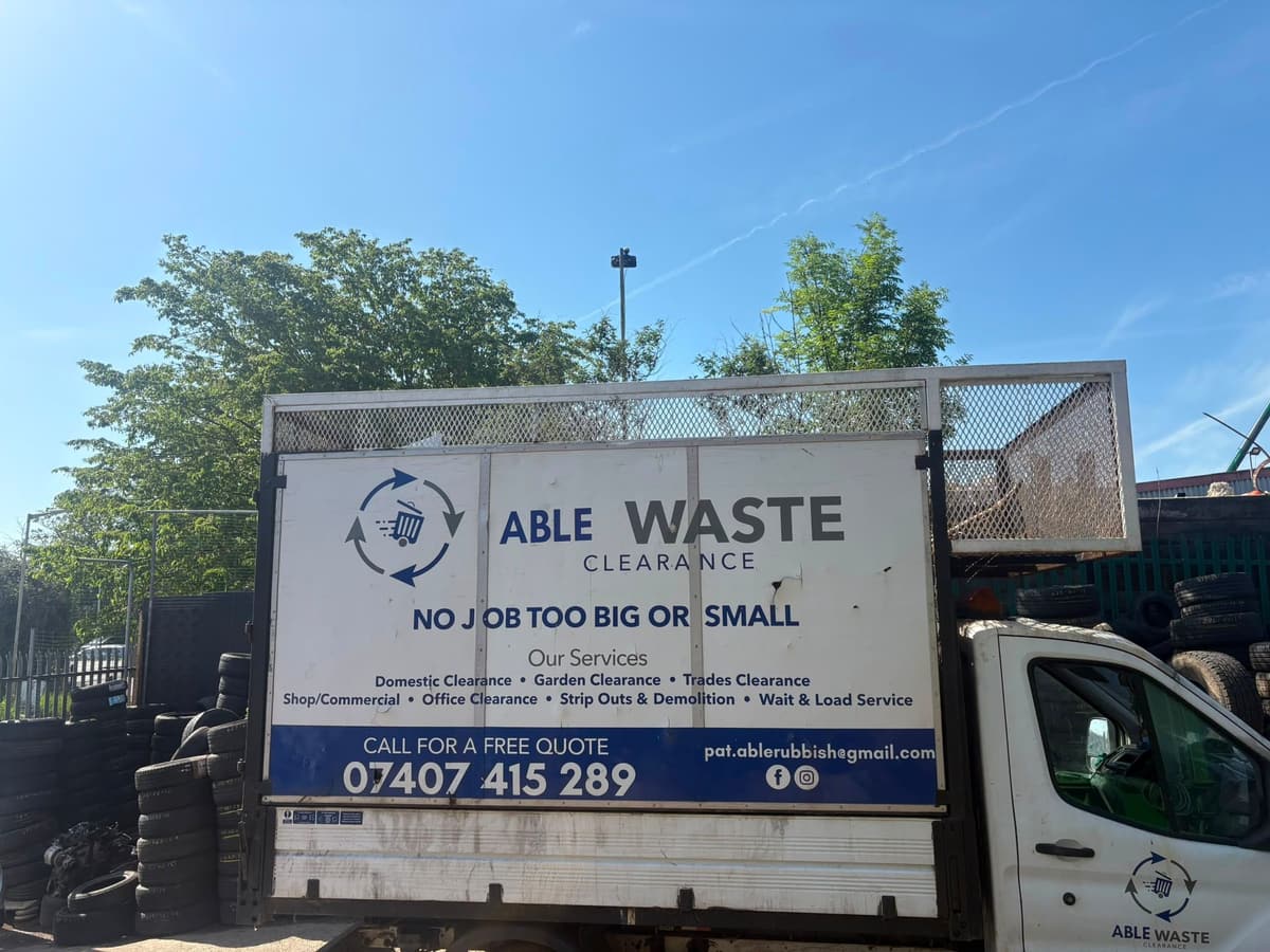 Able Waste Clearance caged tipper van with the slogan No job too big or small and the phone number 07407 415289