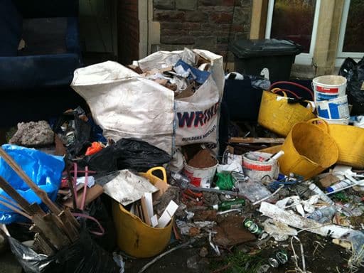 Builders’ bag of rubble, paint tubs and mixed renovation waste awaiting removal