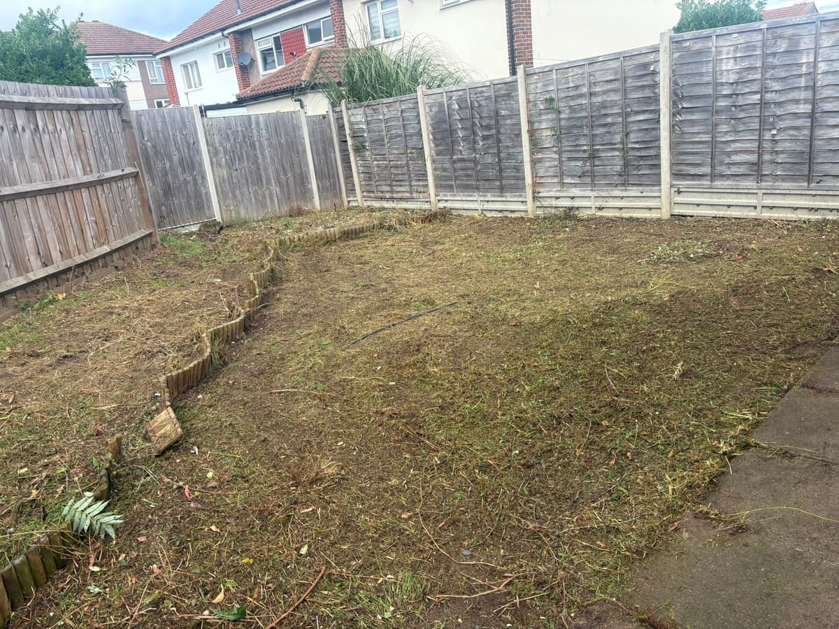 The same back garden after clearance, cut back to bare soil and ready to use